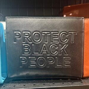 Black Embossed Statement Clutch